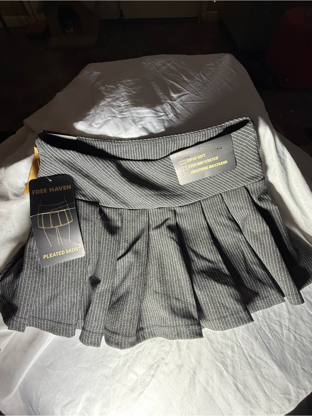 Free Haven Women's Pinstripe Pleated Mini Skort with black bow accents- Black- L - Picture 3 of 7